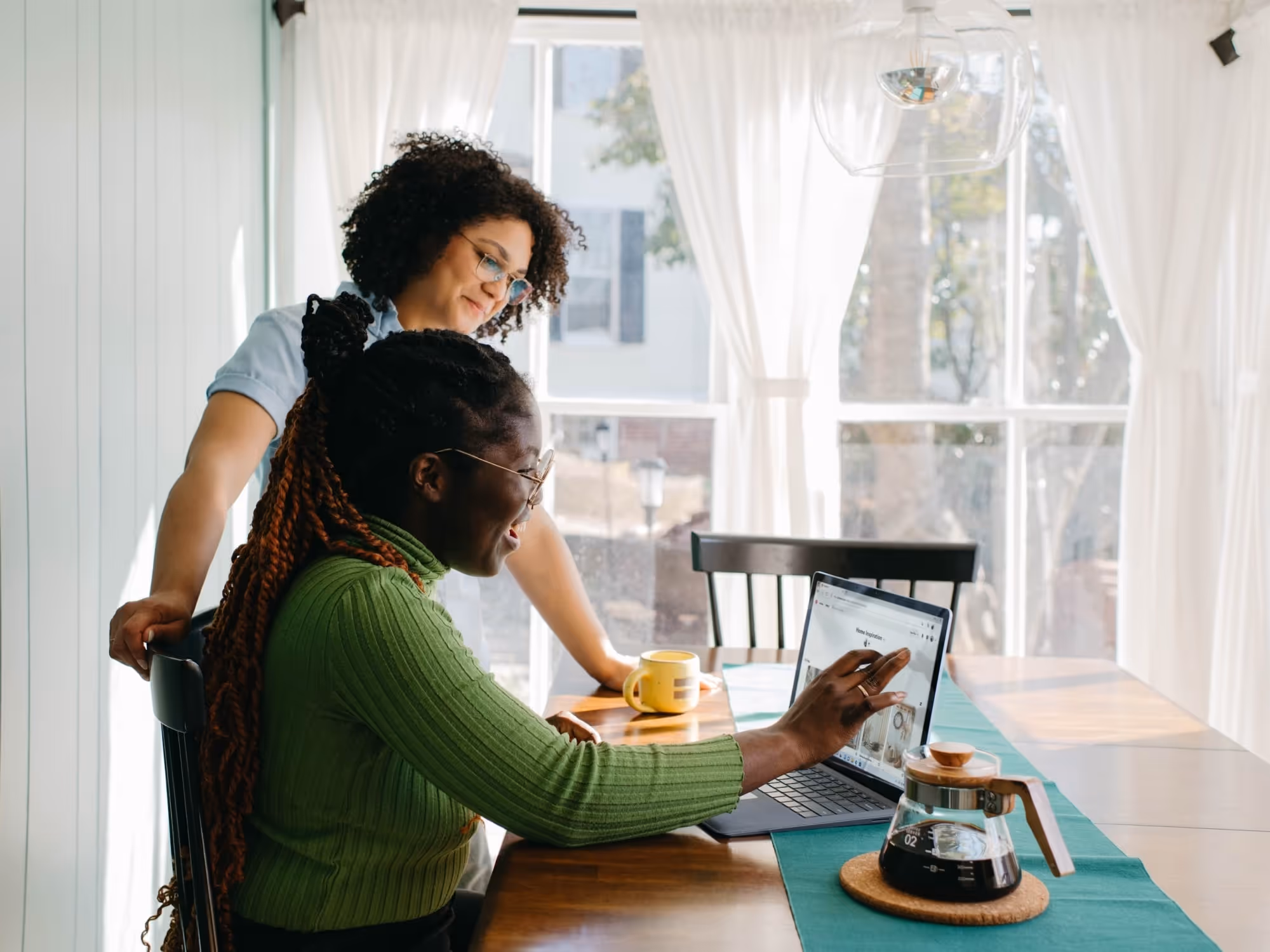 Two women using a computer
